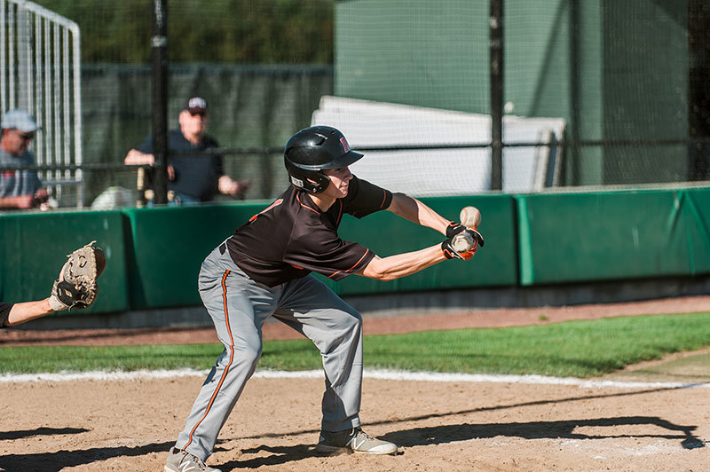 Colby Knutzen goes for a bunt in a 2–0 Borderites win against Meridian on Monday, May 2.  Photo by Janell Kortlever 