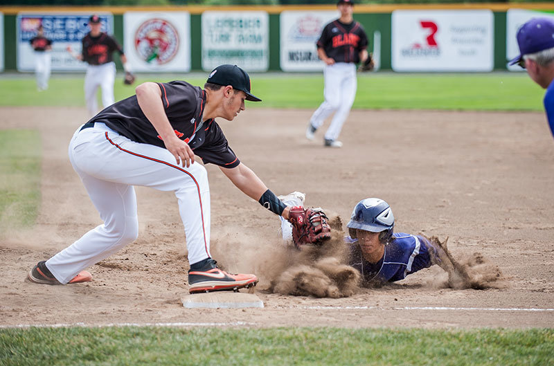 Blaine first baseman Josh Fakkema tags out an Anacortes runner on May 16. Photo by Janell Kortlever 